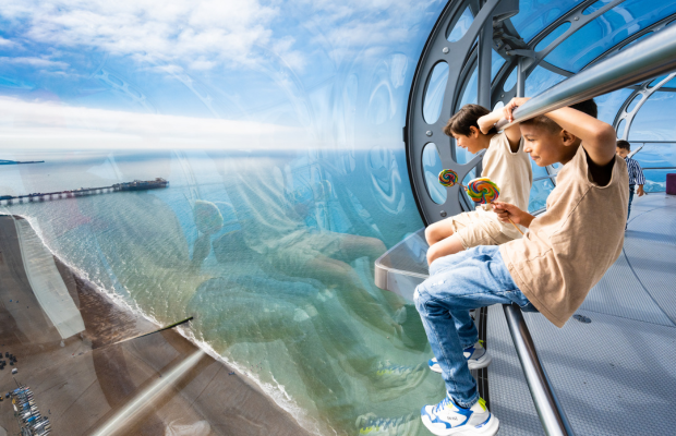 Two boys looking out the Brighton i360 Viewing Pod